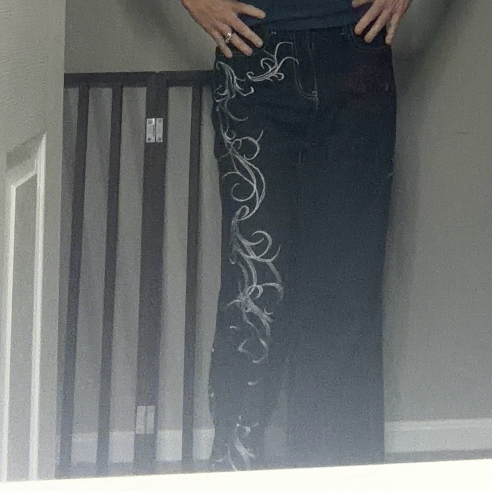 Black and white with red accents Embroidered jeans